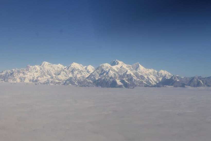 Everest Scenic Flight By Buddha Air with Free Hotel Transfer - Sunrise, clouds, and the limits of mountain weather