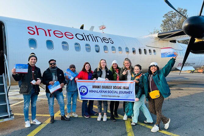 Mountain Everest Scenic Flight with Hotel Pickup and Dropoff - Boarding a small plane with a window view