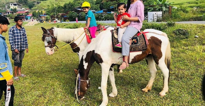 Pokhara: Horseback Riding Adventure with Hotel Pickup - A horseback view of Pokhara beyond the lakeside road
